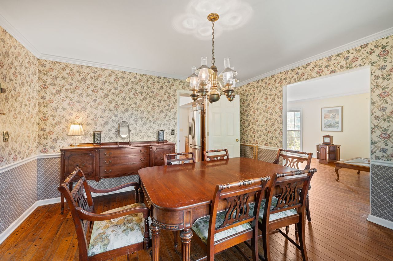 6 Crawling Stone Road Barrington Hills, IL 60010 - Photo 8 of 33 a view of a dining room with furniture and wooden floor