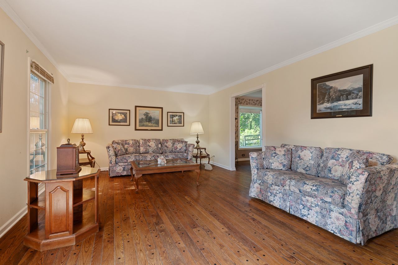 6 Crawling Stone Road Barrington Hills, IL 60010 - Photo 10 of 33 a living room with furniture and a wooden floor