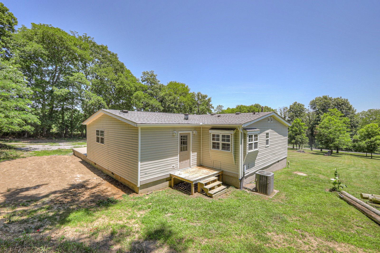 4002 Rippey Lake Road Mount Pleasant, TN 38474 - Photo 6 of 43 a view of a house with a yard and sitting area