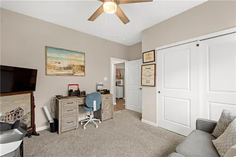 a view of a livingroom with workspace and a couch