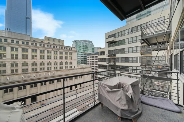 a roof view covered with balcony and ocean view