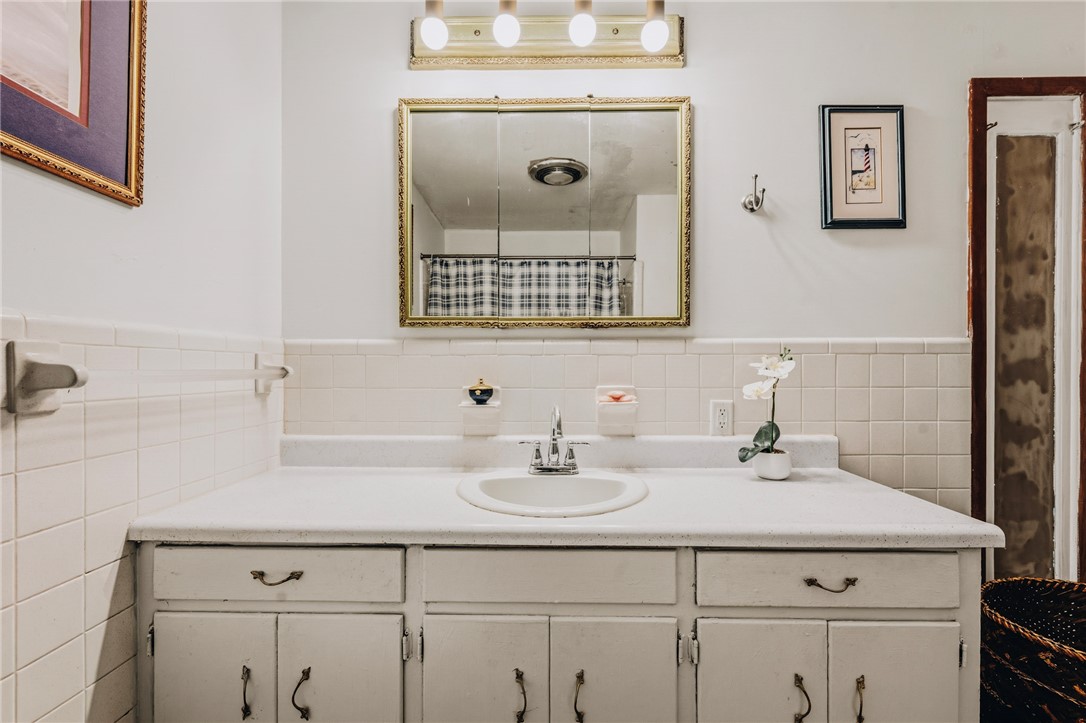 707 Campbell Town Road Walhalla, SC 29691 - Photo 18 of 44 Classic tiling accents the vanity area of this all white bathroom.