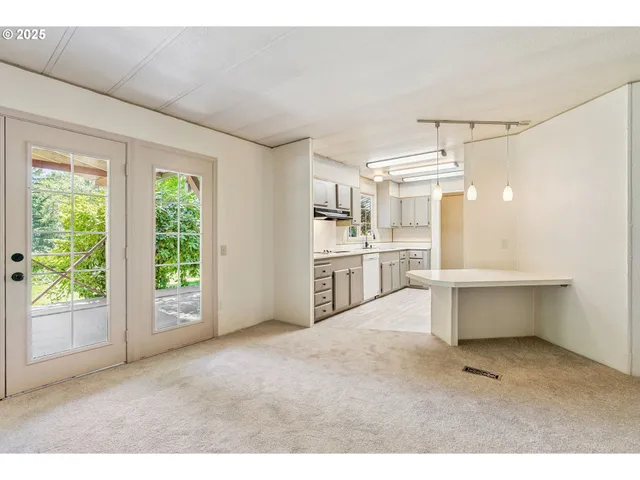 a living room with a fireplace and a window