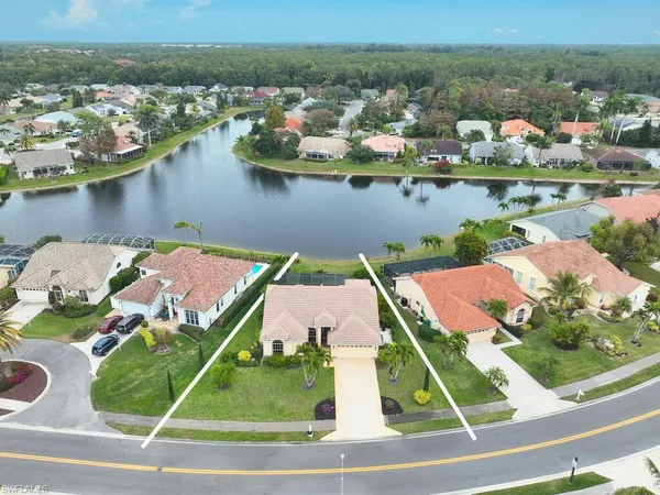 an aerial view of a house with a ocean view