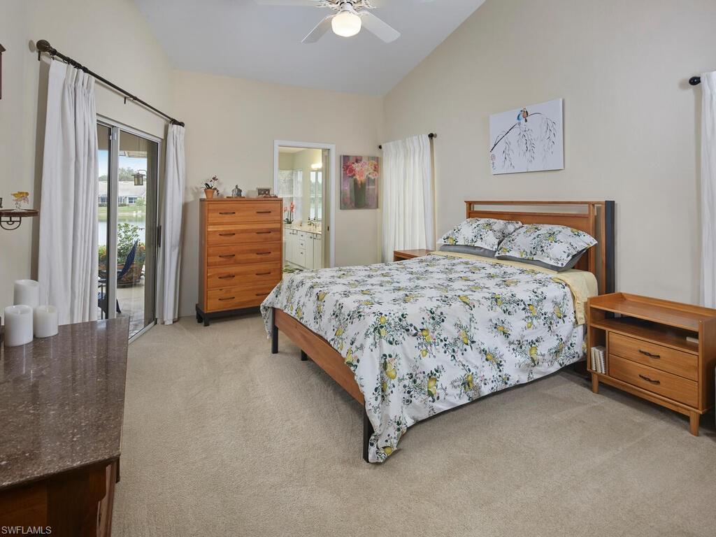 2126 East Crown Pointe Boulevard Naples, FL 34112 - Photo 12 of 26 a bedroom with a bed and dresser