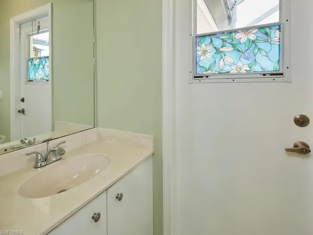 a view of a workspace with furniture