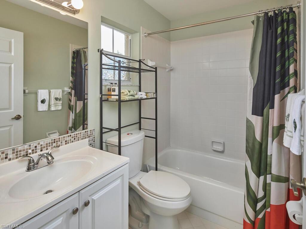 2126 East Crown Pointe Boulevard Naples, FL 34112 - Photo 15 of 26 a bathroom with a sink toilet and shower