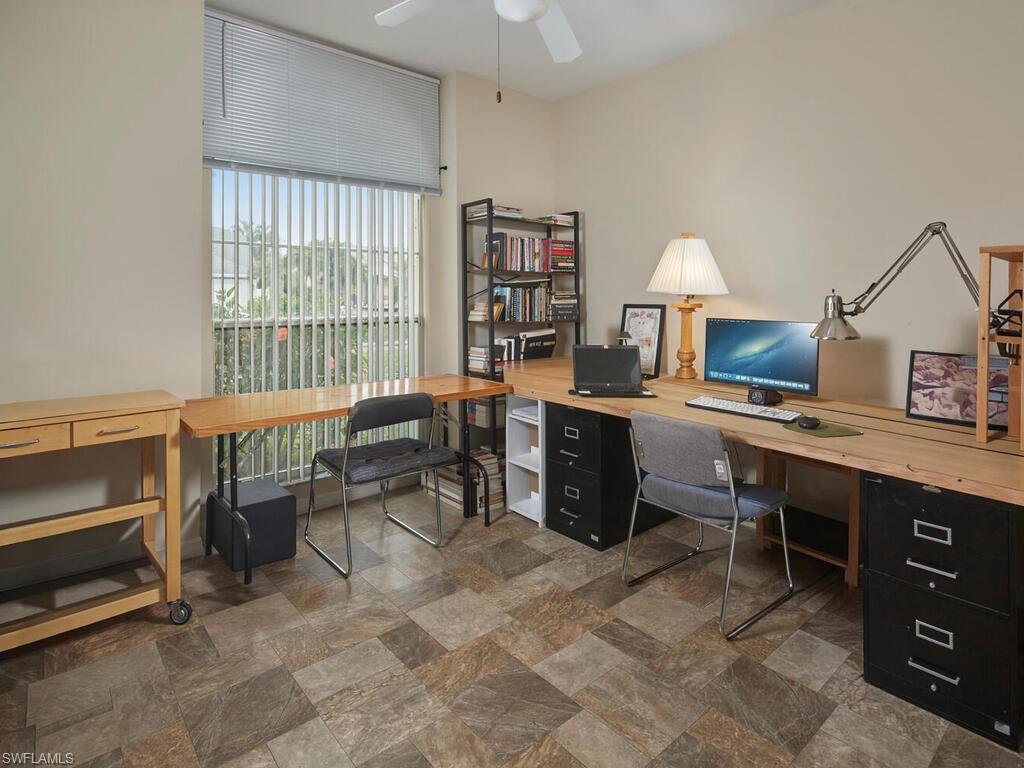 2126 East Crown Pointe Boulevard Naples, FL 34112 - Photo 15 of 26 a view of a workspace with furniture