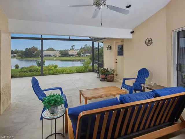 a view of a house with a yard and a table