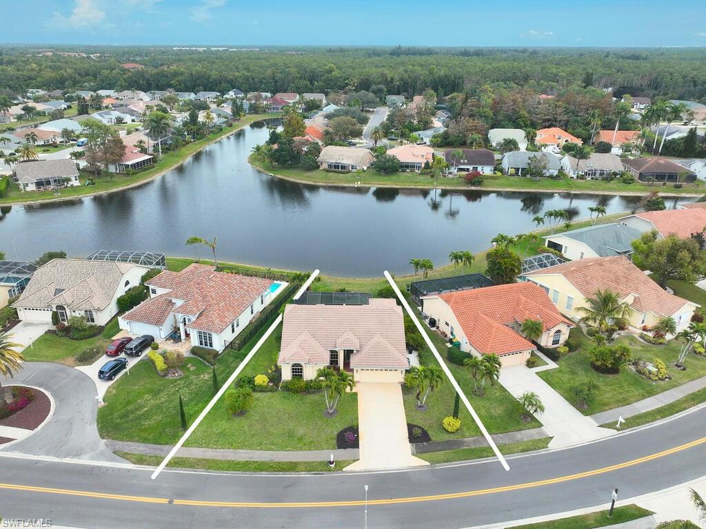 2126 East Crown Pointe Boulevard Naples, FL 34112 - Photo 22 of 26 an aerial view of a house with a ocean view
