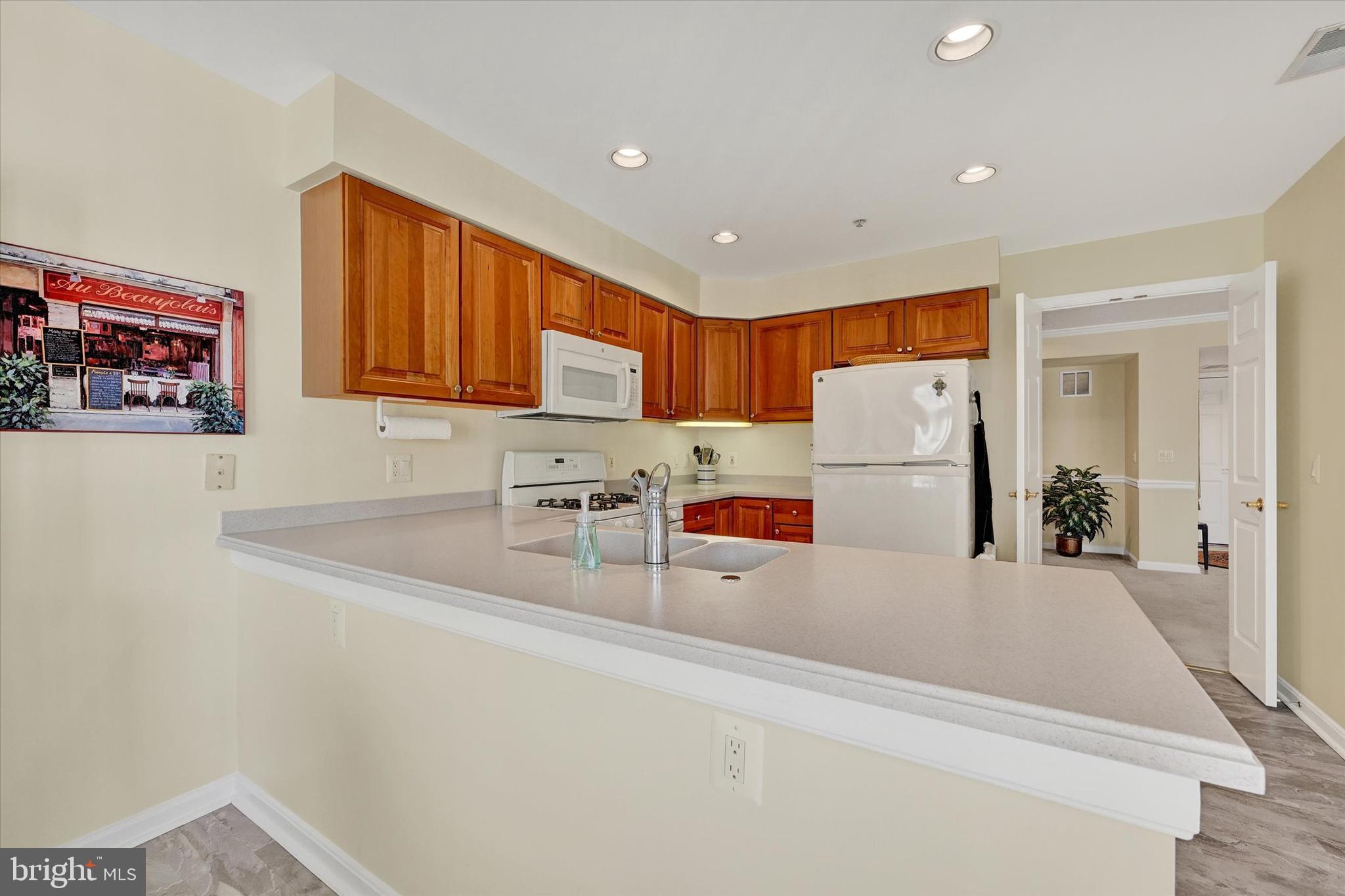 12330 Rosslare Ridge Road, Unit 403 Lutherville-Timonium, MD 21093 - Photo 13 of 33 Spacious kitchen w/corian counter-tops