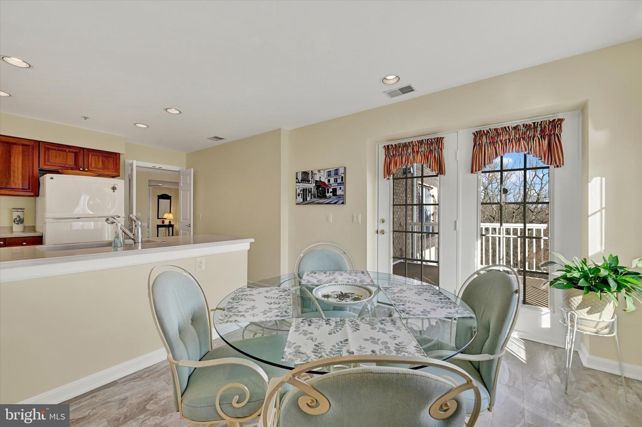 12330 Rosslare Ridge Road, Unit 403 Lutherville-Timonium, MD 21093 - Photo 17 of 33 eating area w/doors leading to 12 x 11 balcony