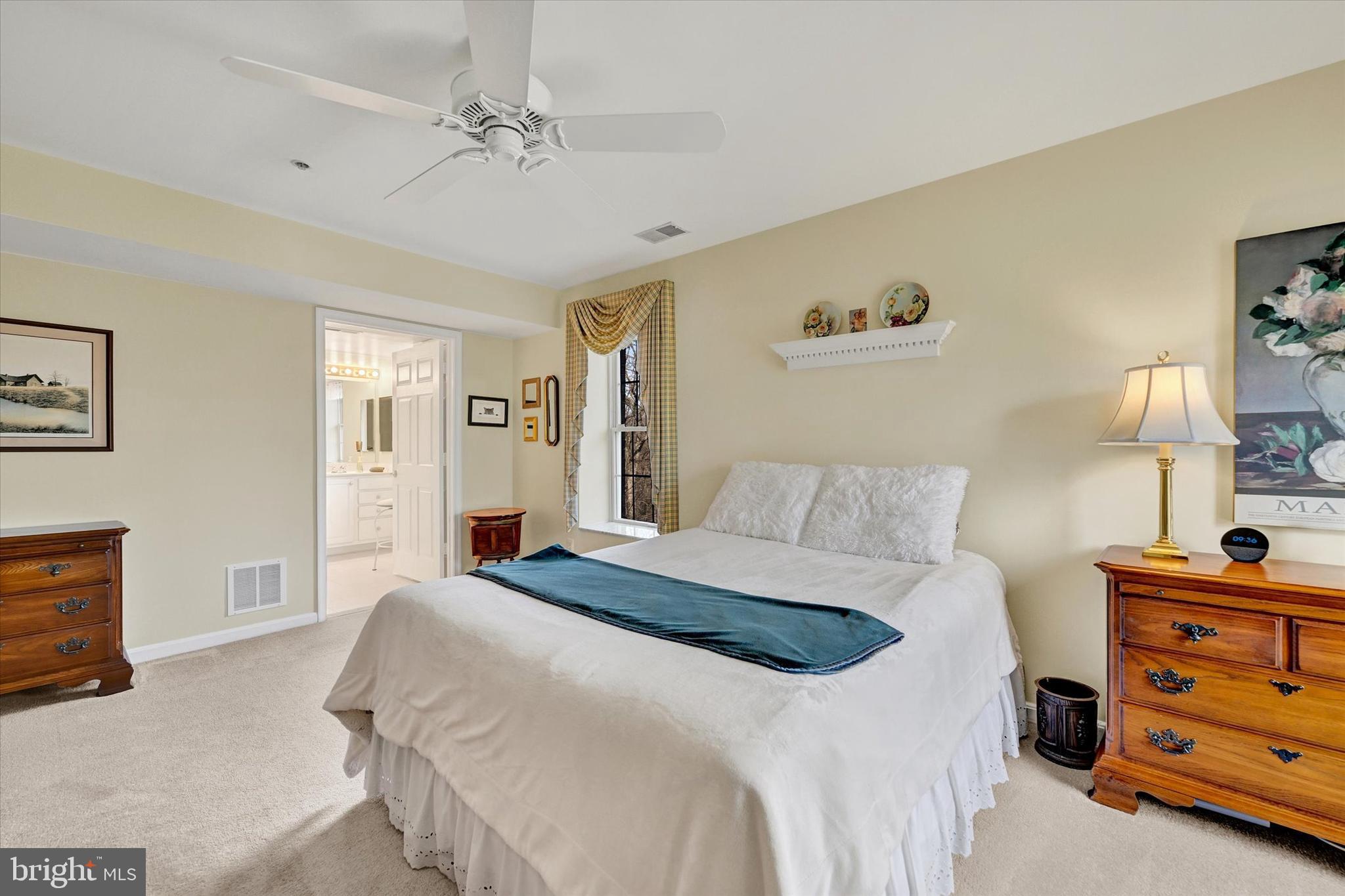 12330 Rosslare Ridge Road, Unit 403 Lutherville-Timonium, MD 21093 - Photo 23 of 33 Primary bedroom w/ceiling fan