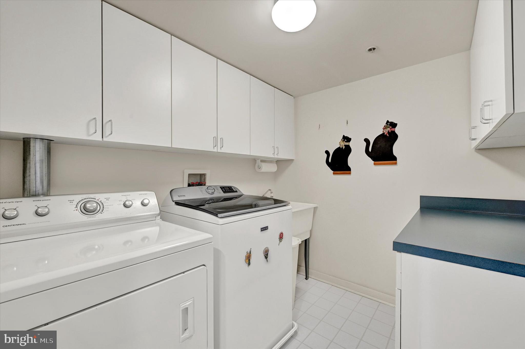 12330 Rosslare Ridge Road, Unit 403 Lutherville-Timonium, MD 21093 - Photo 31 of 33 Laundryrm , w/dryer, washer and utility sink