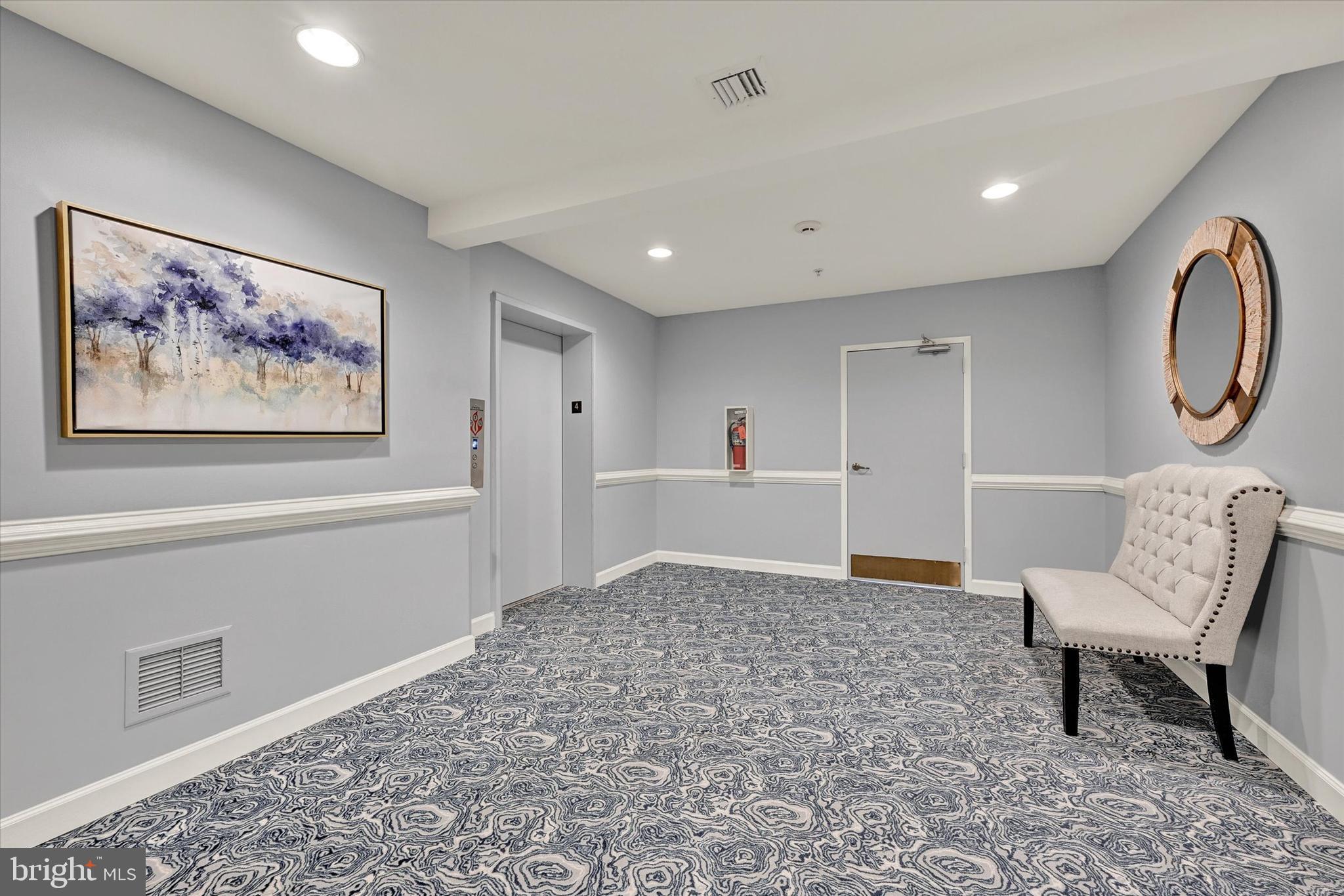 12330 Rosslare Ridge Road, Unit 403 Lutherville-Timonium, MD 21093 - Photo 5 of 33 hallway leading to elevator