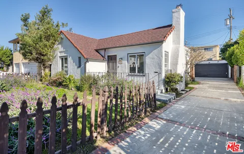 a front view of house and yard with green space