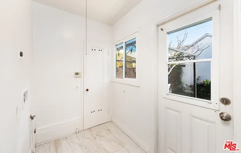 a view of a door and a window in a room