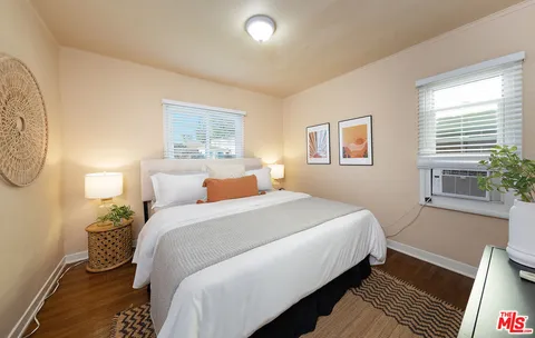 a bedroom with bed and window