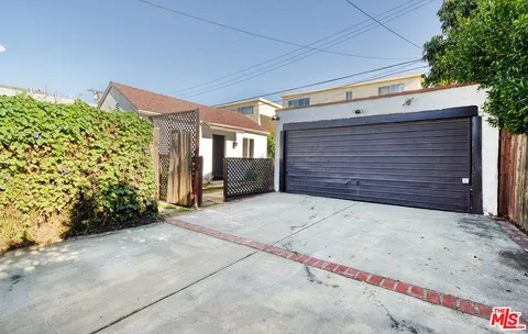 a view of a backyard with sitting area
