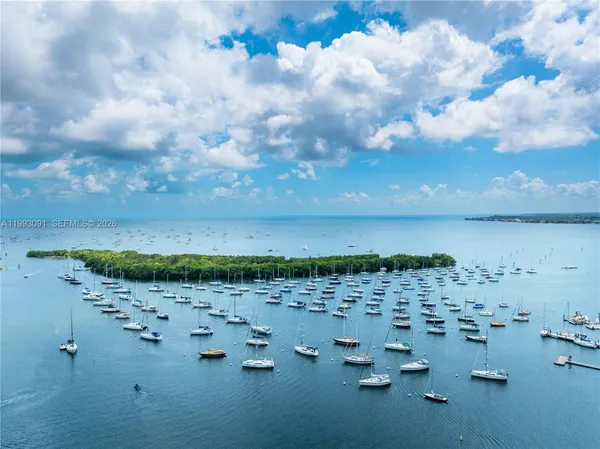 an aerial view of a house with a lake view