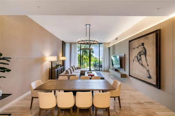 a view of a dining room with furniture window and wooden floor