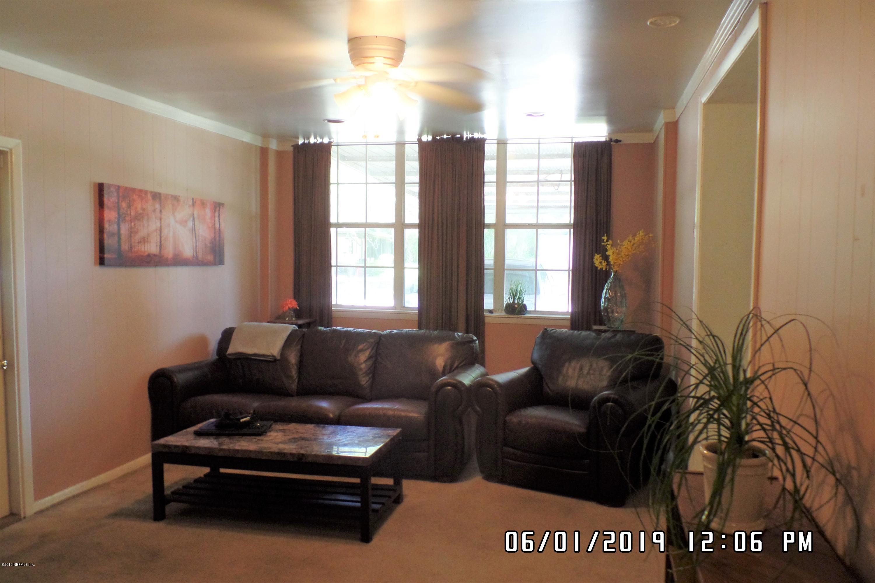 2925 Kent Road Jacksonville, FL 32216 - Photo 11 of 24 a living room with furniture and a window