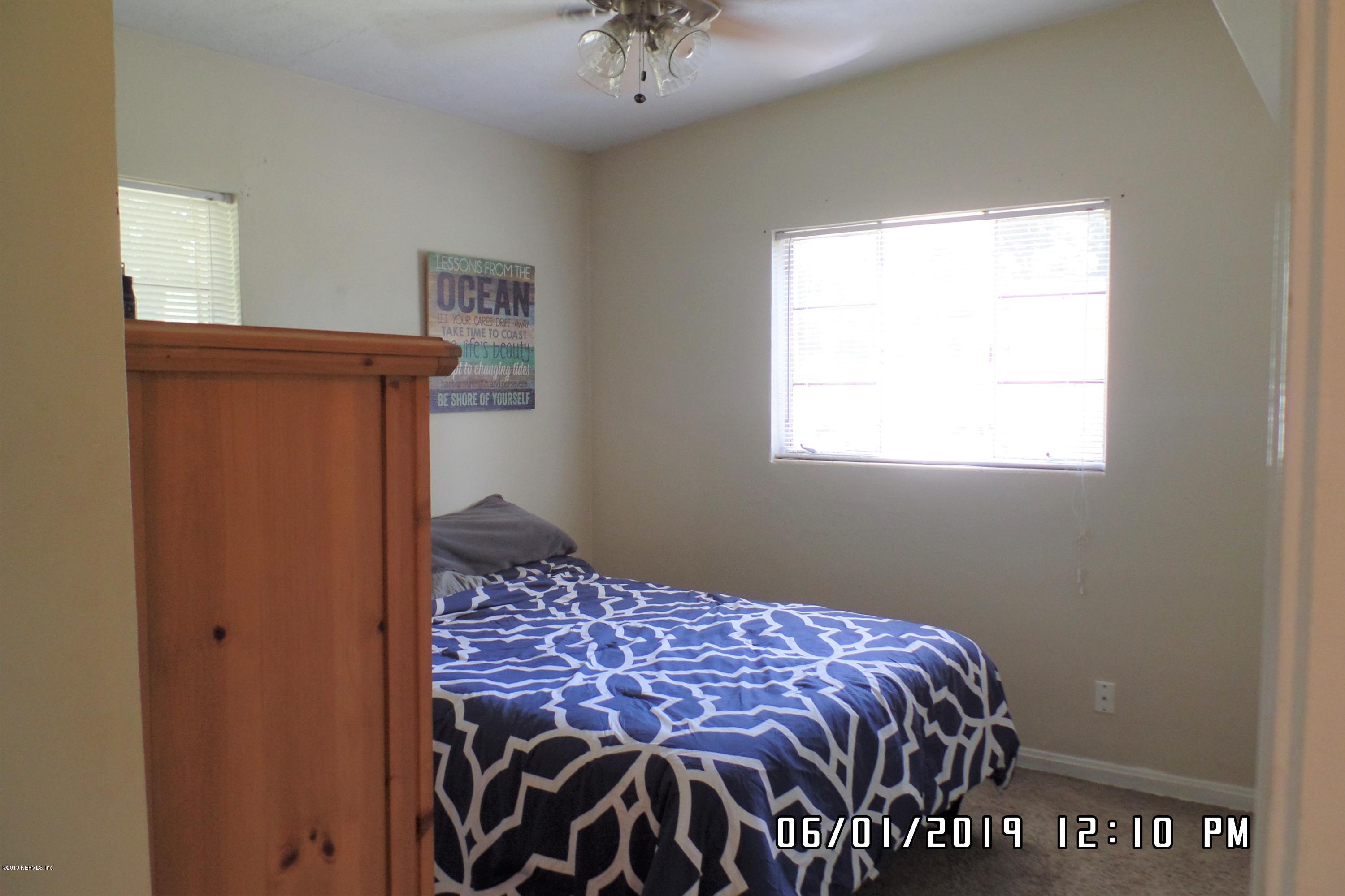 2925 Kent Road Jacksonville, FL 32216 - Photo 13 of 24 a bedroom with a bed and a window