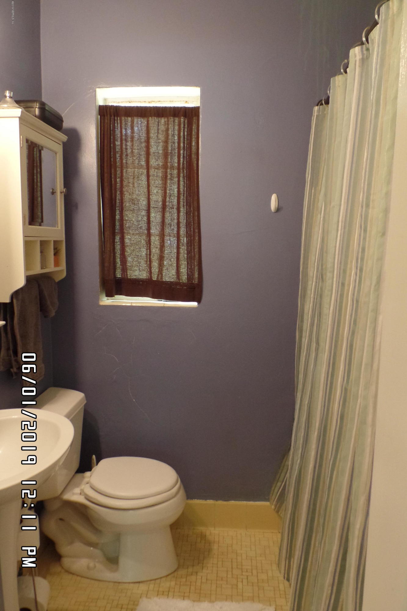 2925 Kent Road Jacksonville, FL 32216 - Photo 17 of 24 a white toilet sitting next to a bathroom sink