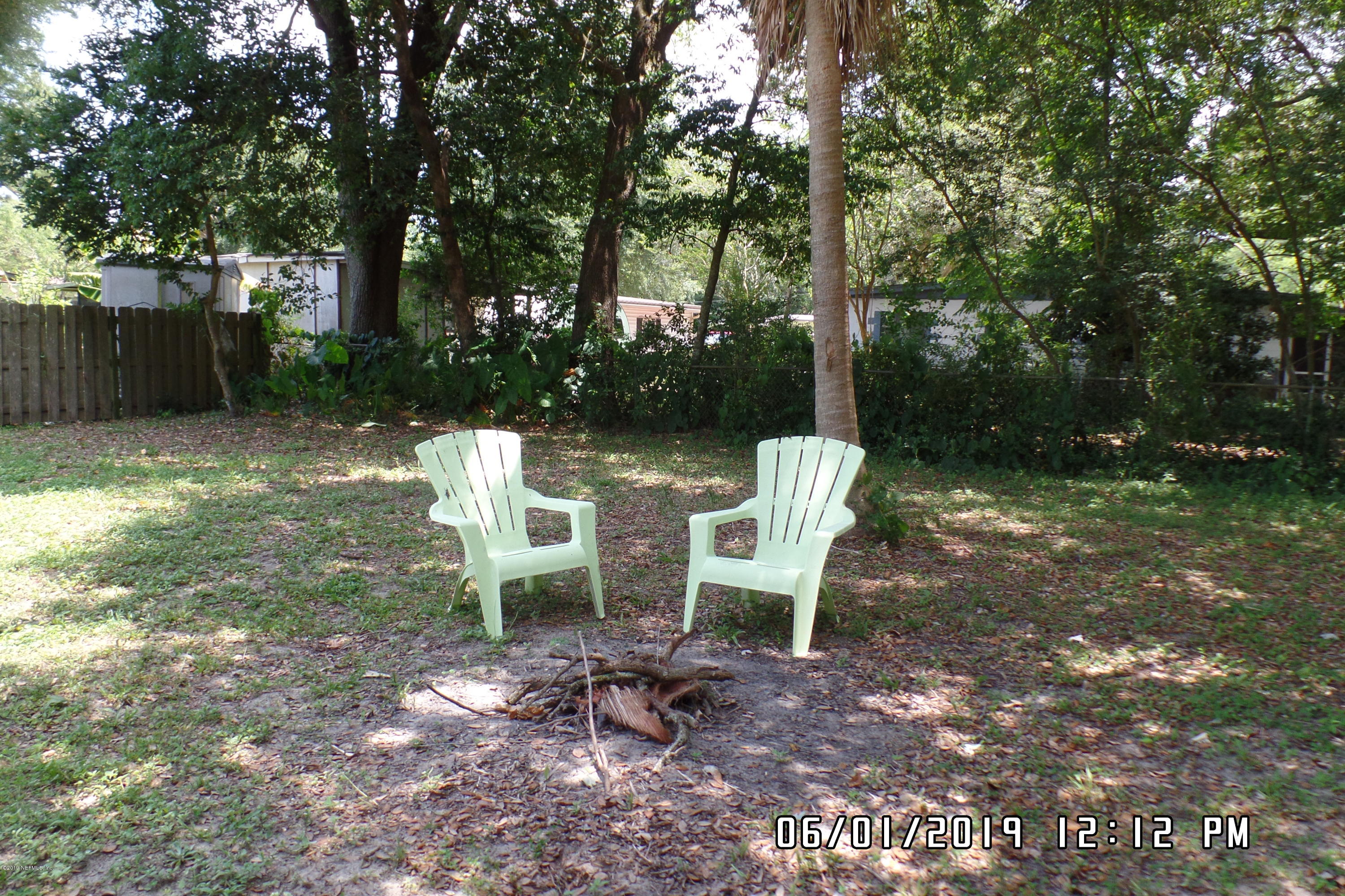 2925 Kent Road Jacksonville, FL 32216 - Photo 21 of 24 a view of a chair and table in backyard