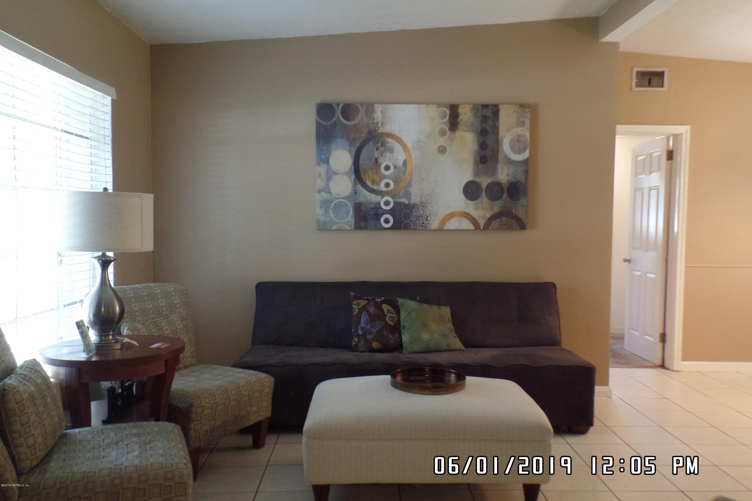 2925 Kent Road Jacksonville, FL 32216 - Photo 6 of 24 a living room with furniture and a window