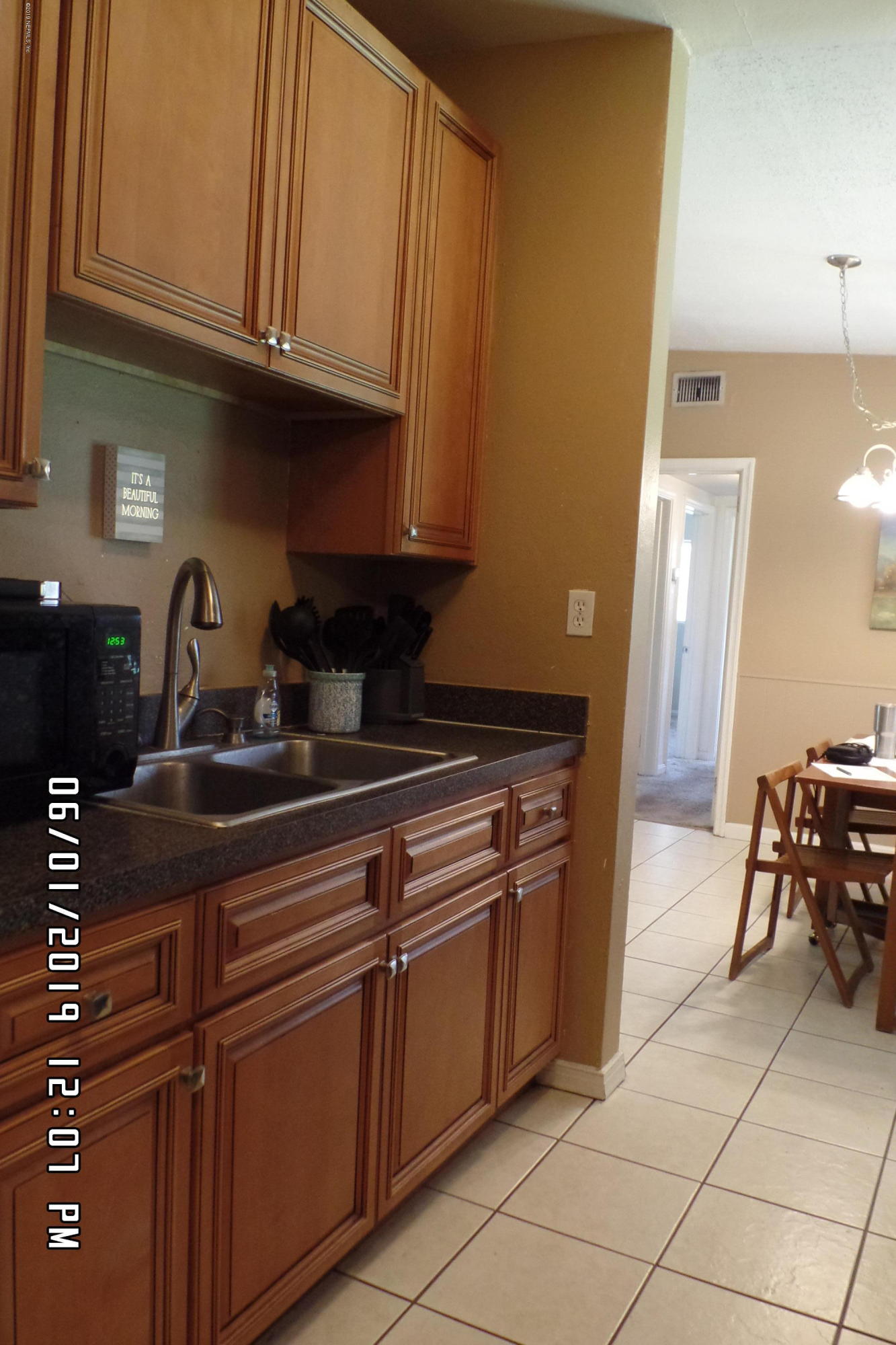 2925 Kent Road Jacksonville, FL 32216 - Photo 8 of 24 a kitchen with granite countertop a sink and cabinets