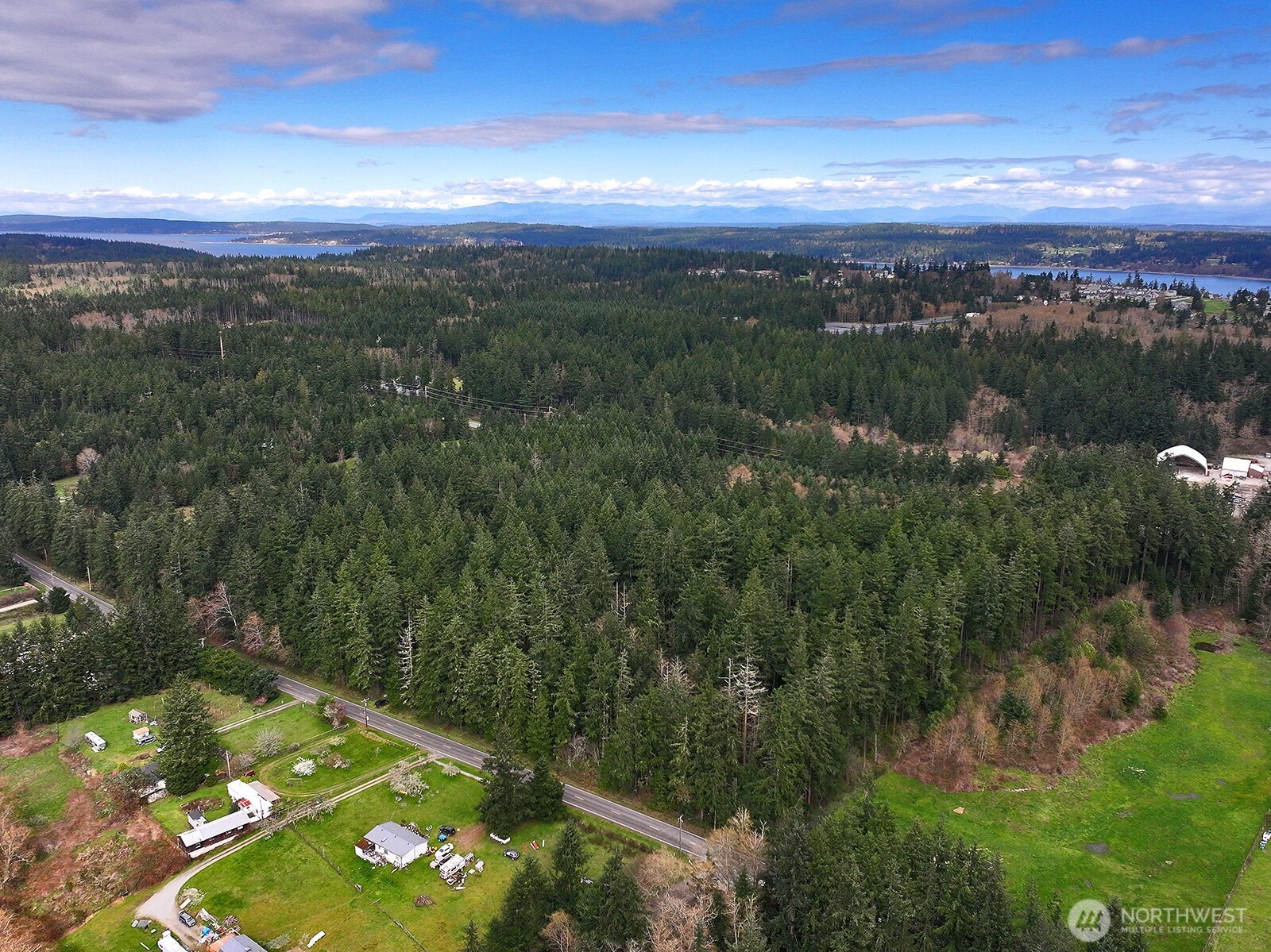 -xxx Mutiny Bay Road Freeland, WA 98249 - Photo 18 of 27 a view of a city with lush green forest