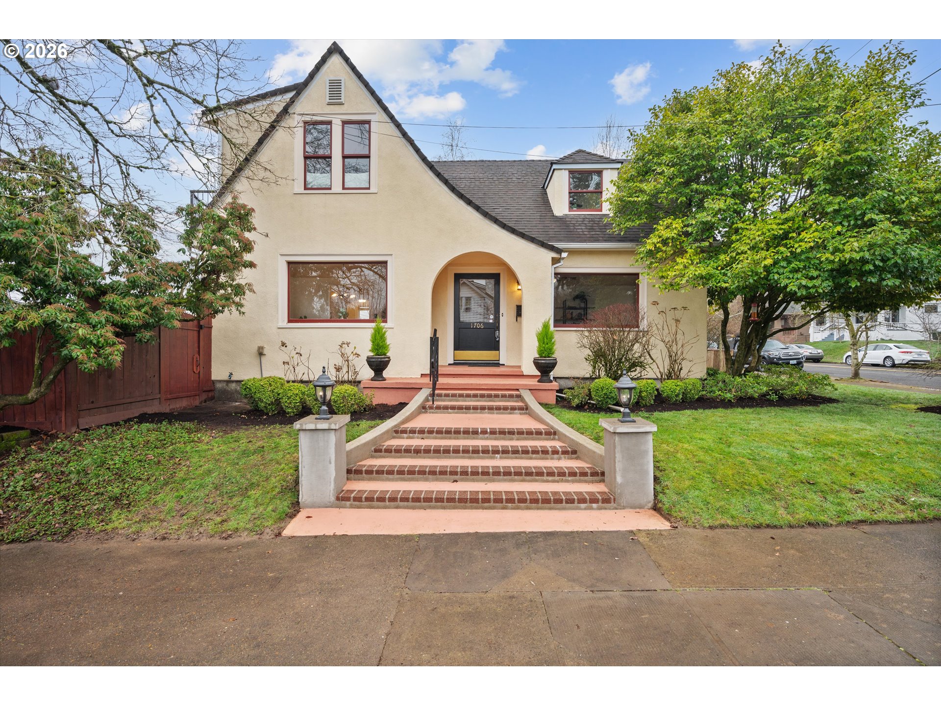 a front view of a house with a yard