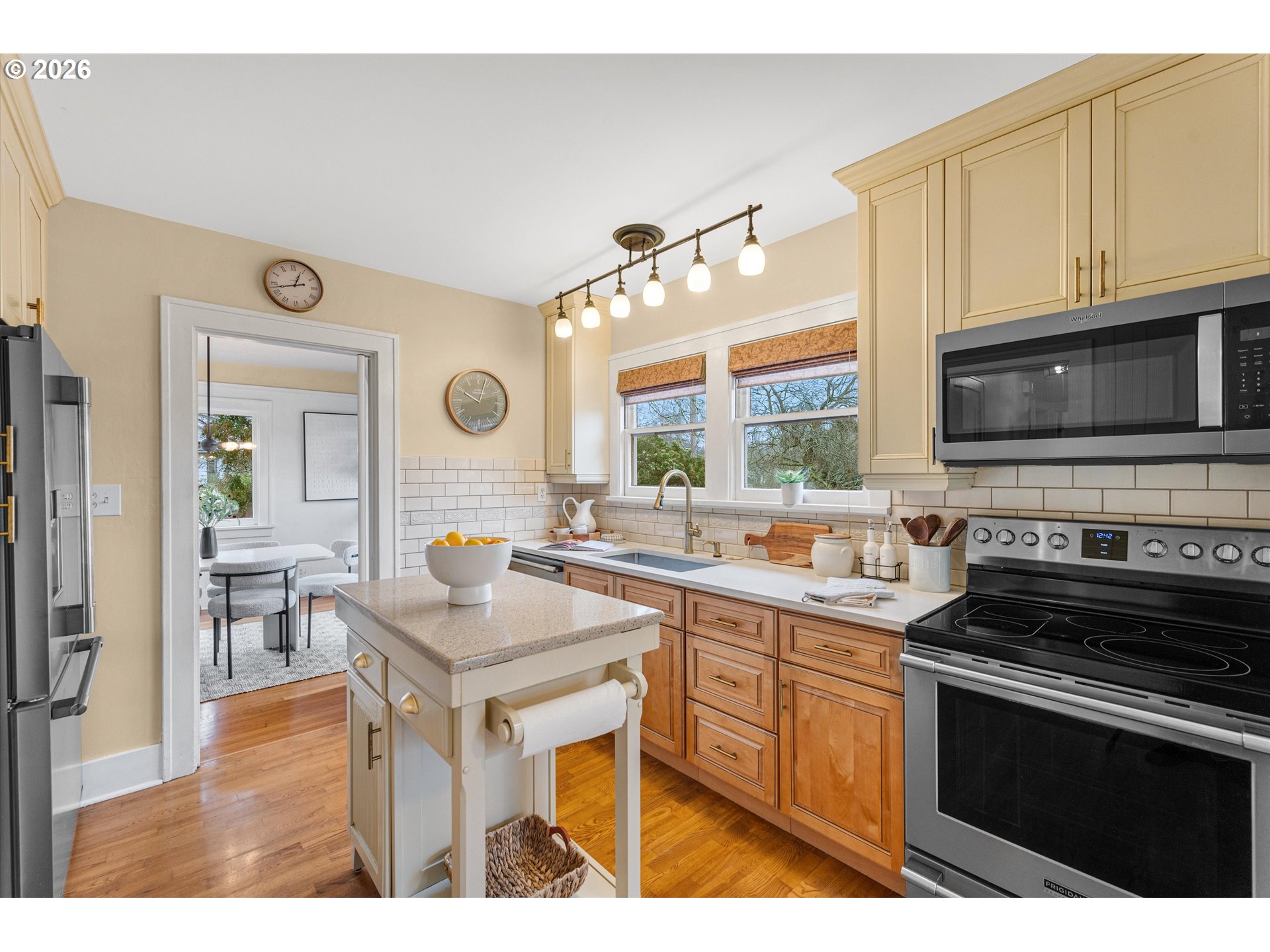 1706 Southeast Knapp Street Portland, OR 97202 - Photo 11 of 43 a kitchen with stainless steel appliances granite countertop a stove and a sink