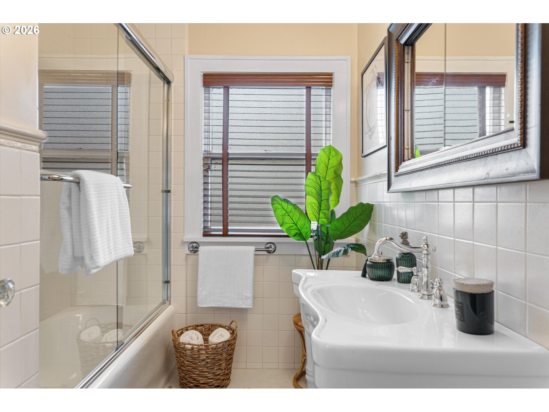 1706 Southeast Knapp Street Portland, OR 97202 - Photo 17 of 43 a bathroom with a sink a potted plant and a shower