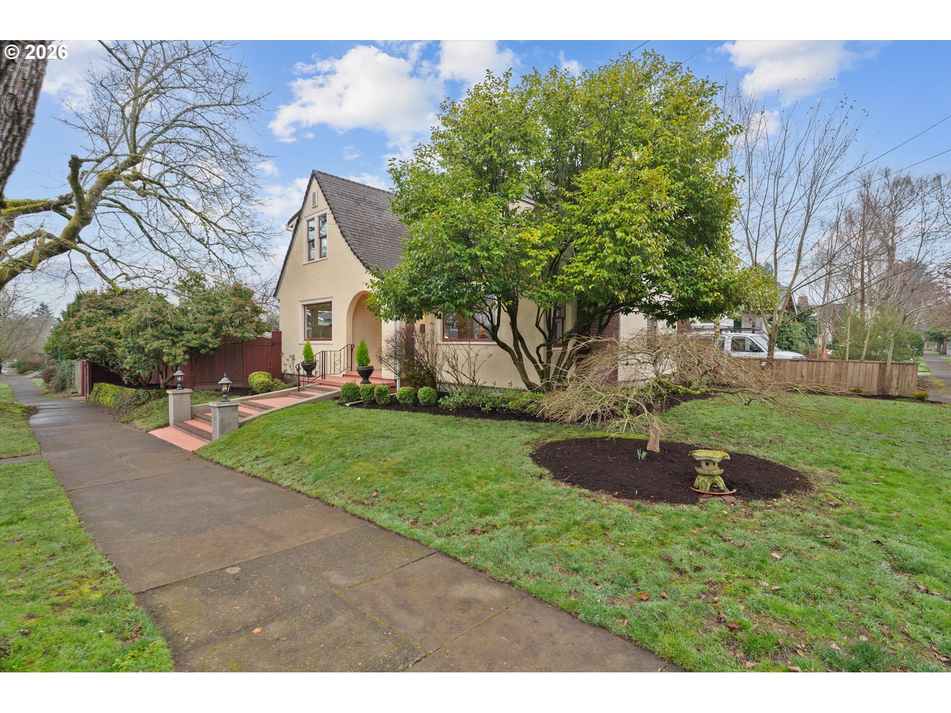 1706 Southeast Knapp Street Portland, OR 97202 - Photo 2 of 43 a view of a backyard with large trees
