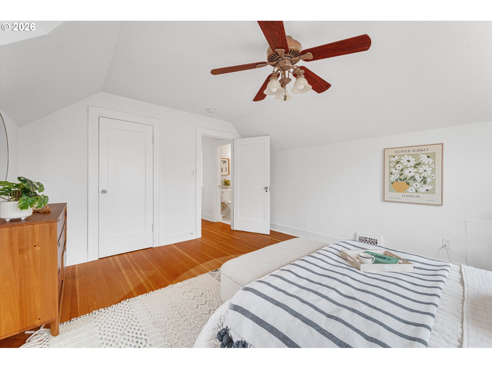 1706 Southeast Knapp Street Portland, OR 97202 - Photo 24 of 43 a bedroom with a bed and a dresser