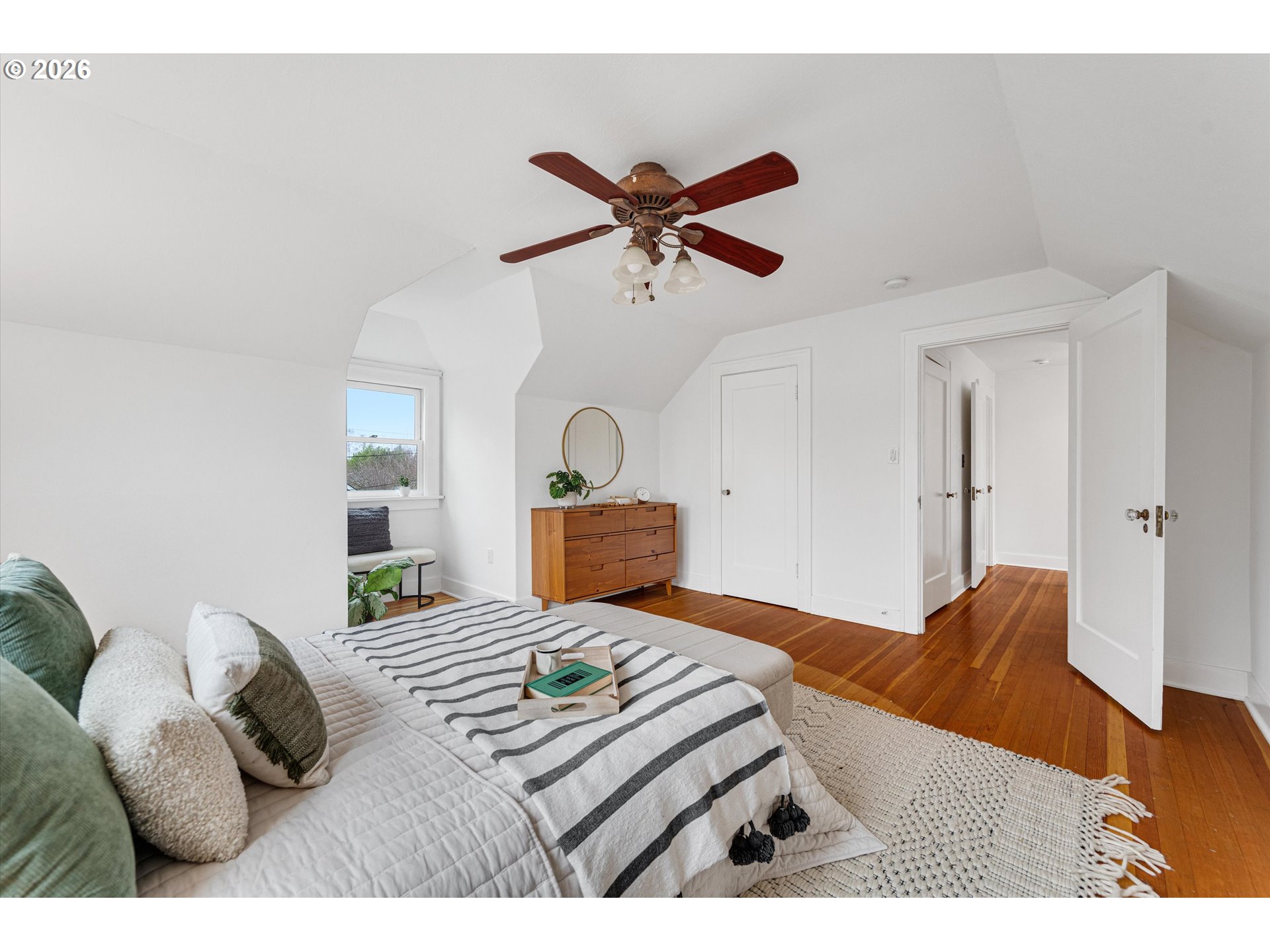 1706 Southeast Knapp Street Portland, OR 97202 - Photo 25 of 43 a bedroom with a bed and wooden floor
