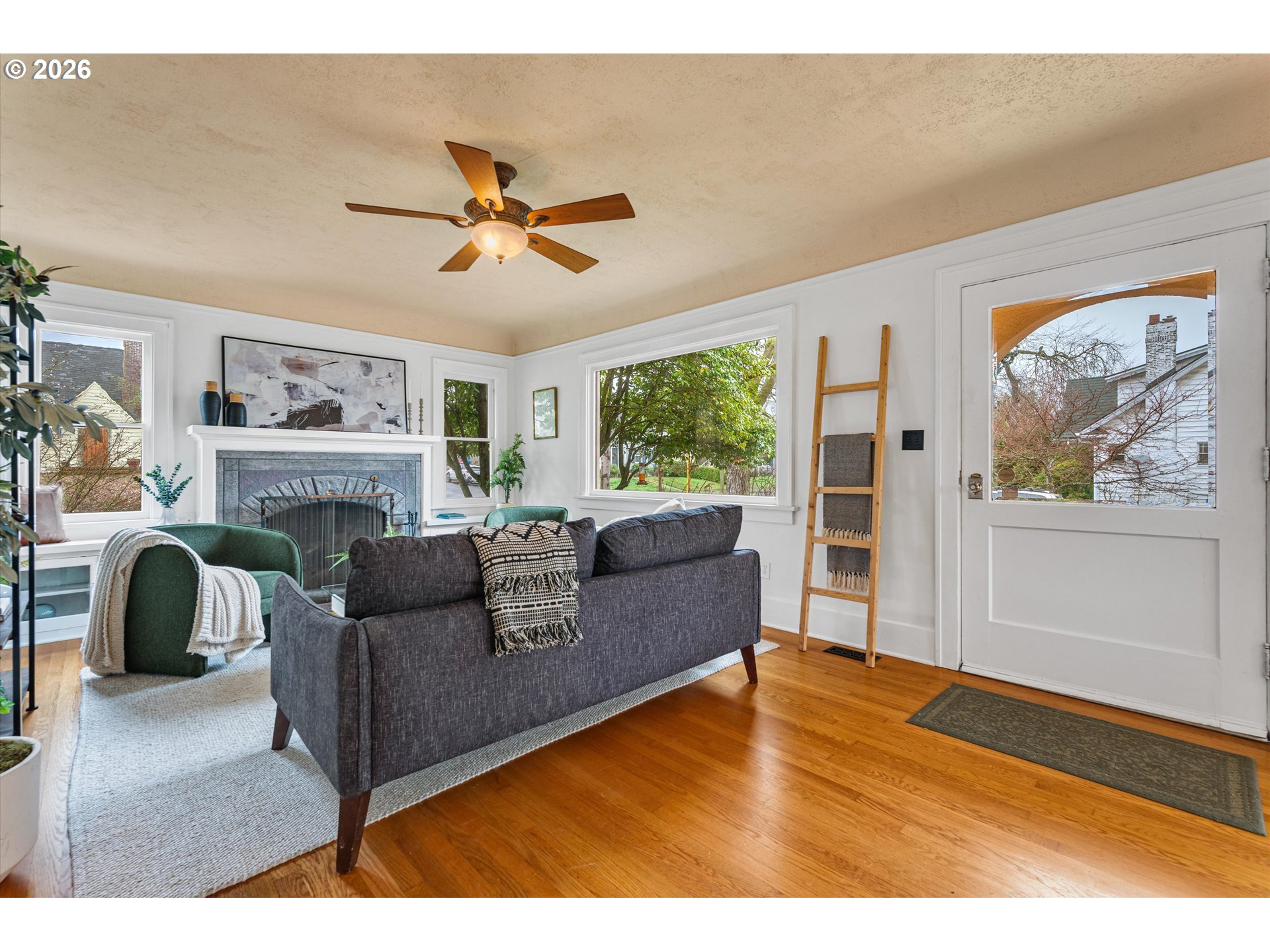 1706 Southeast Knapp Street Portland, OR 97202 - Photo 3 of 43 a living room with furniture and a fireplace
