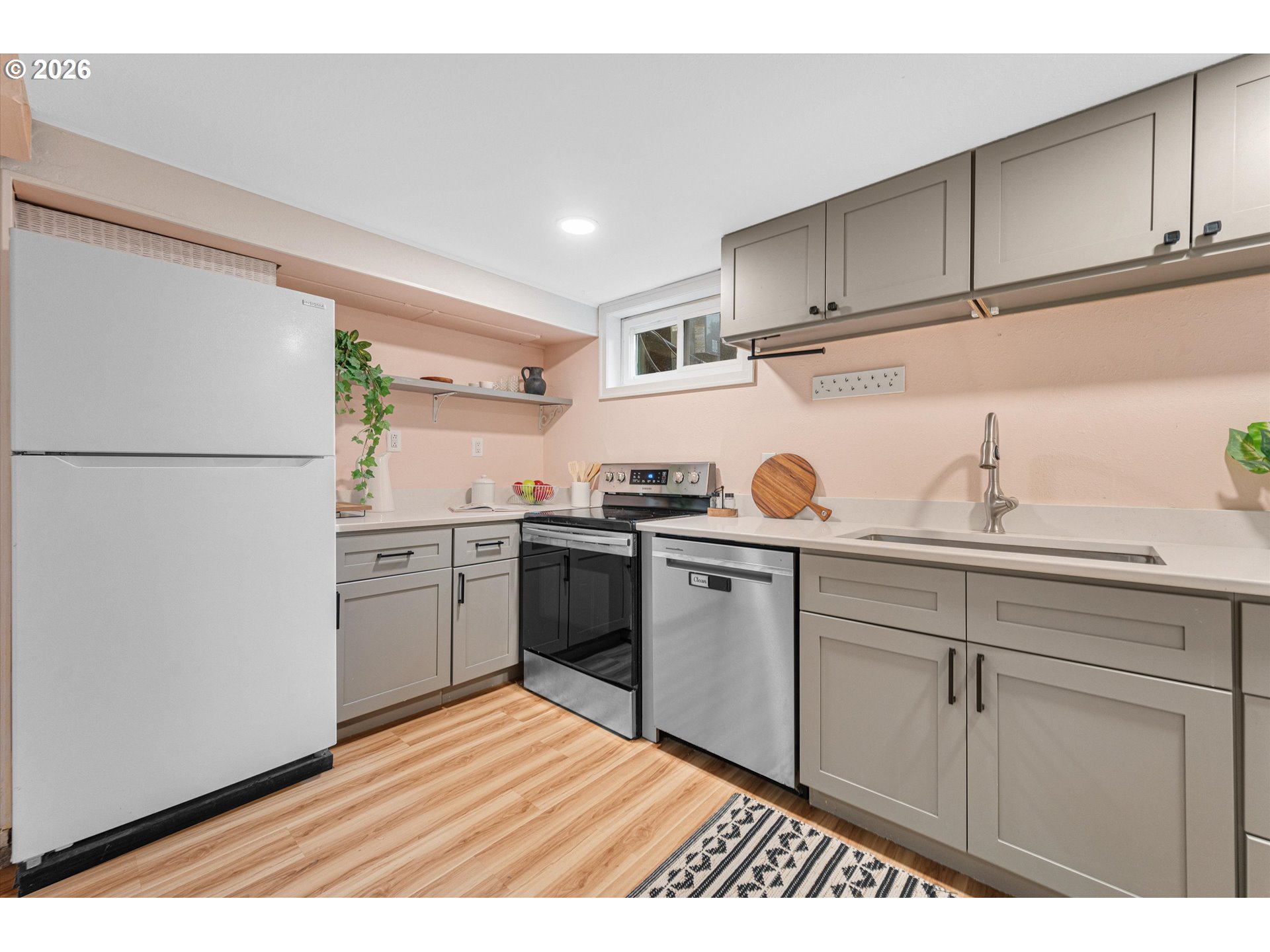 1706 Southeast Knapp Street Portland, OR 97202 - Photo 33 of 43 a kitchen with a refrigerator and a sink