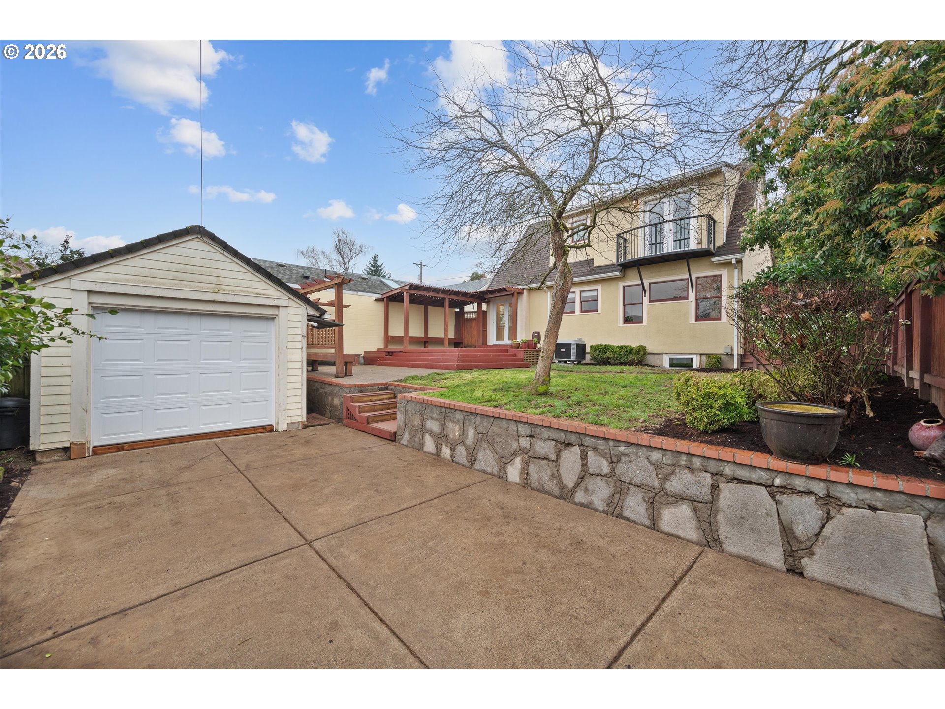 1706 Southeast Knapp Street Portland, OR 97202 - Photo 38 of 43 a view of a house with a yard and potted plants
