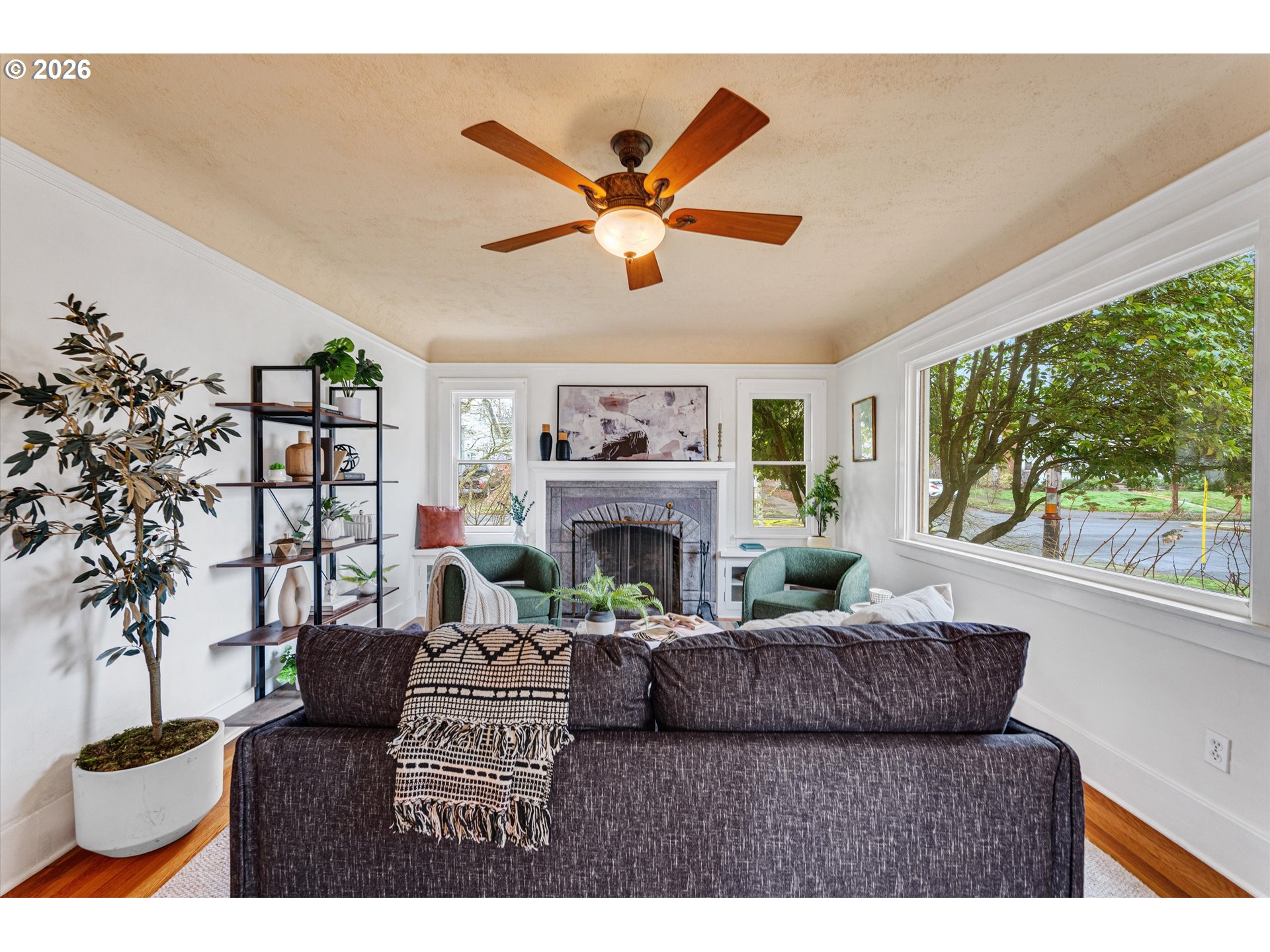 1706 Southeast Knapp Street Portland, OR 97202 - Photo 4 of 43 a living room with furniture flower pot and a fireplace