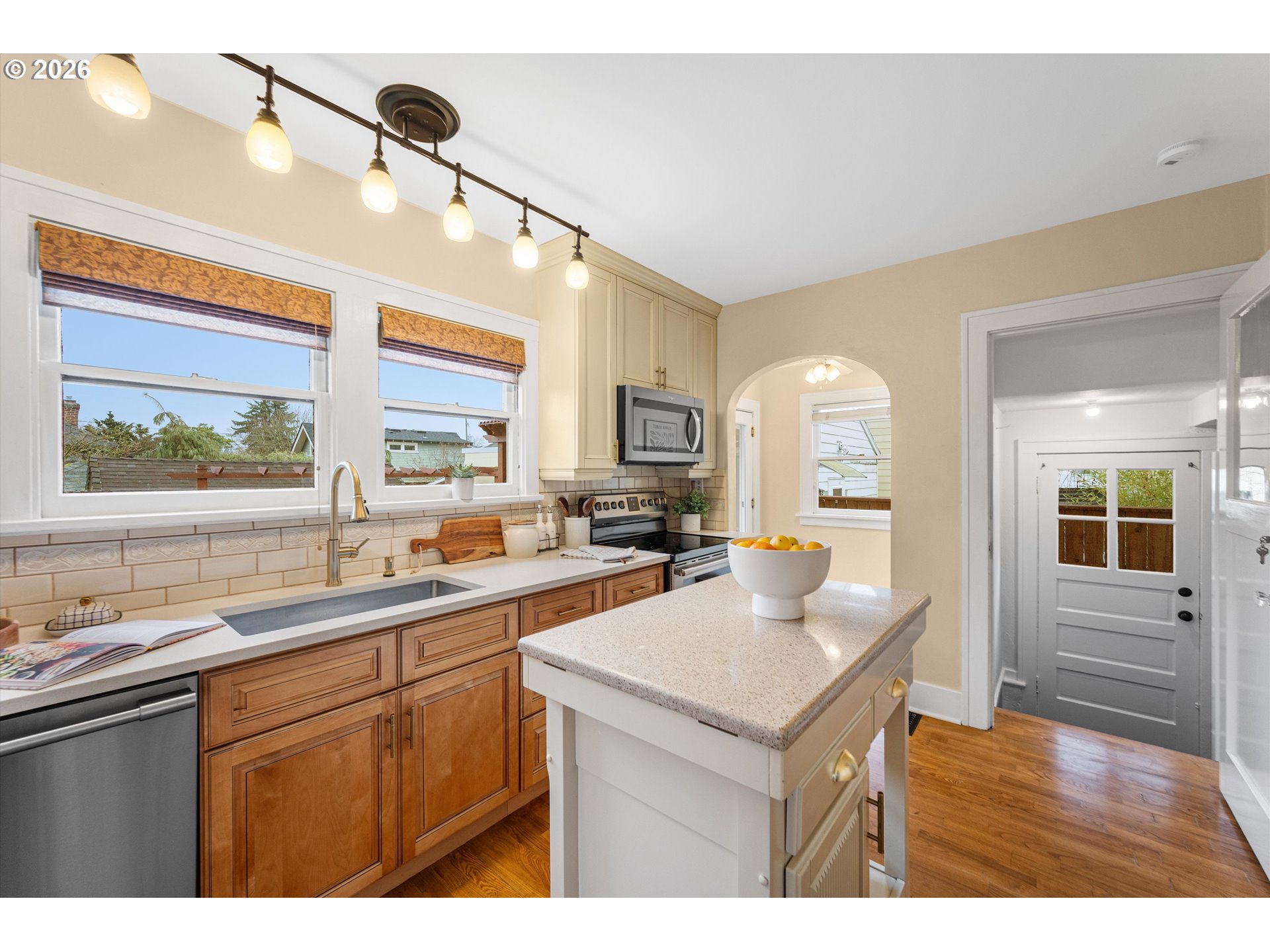 1706 Southeast Knapp Street Portland, OR 97202 - Photo 10 of 43 a kitchen with a sink cabinets and window