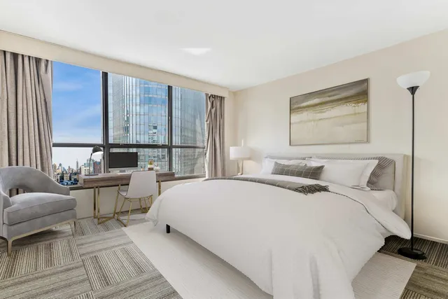 a bed room with a bed and a couch