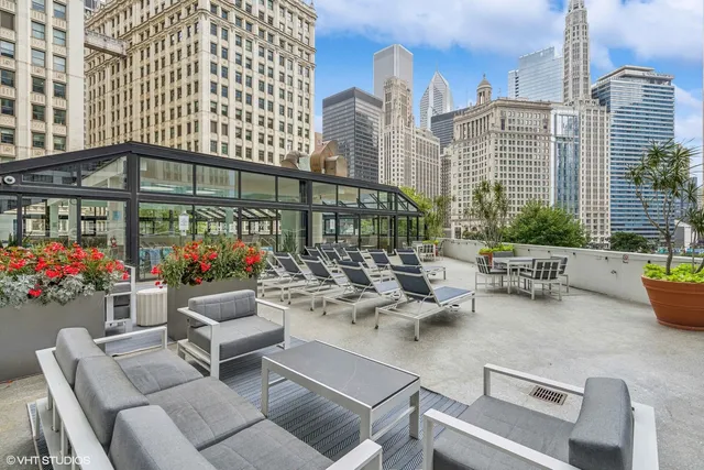 a view of a patio with couches and potted plants