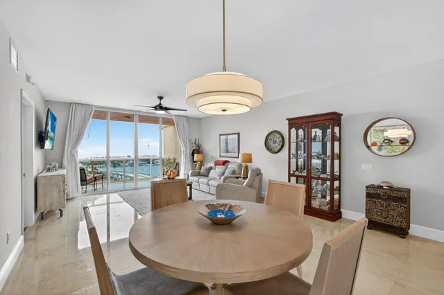 a view of a dining room with furniture and a large window