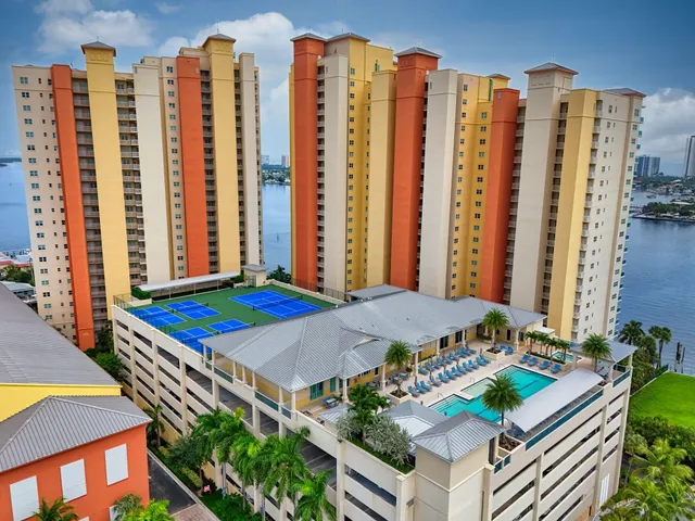 a bedroom with furniture and a large window