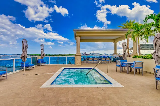 a view of swimming pool with outdoor seating