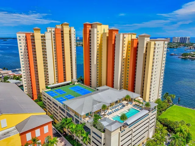 a bedroom with furniture and a large window