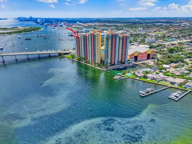 an aerial view of a pool with a yard
